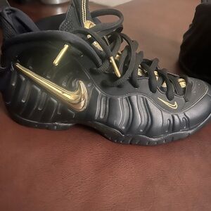 Nike Foamposite Sneakers in Black and Gold